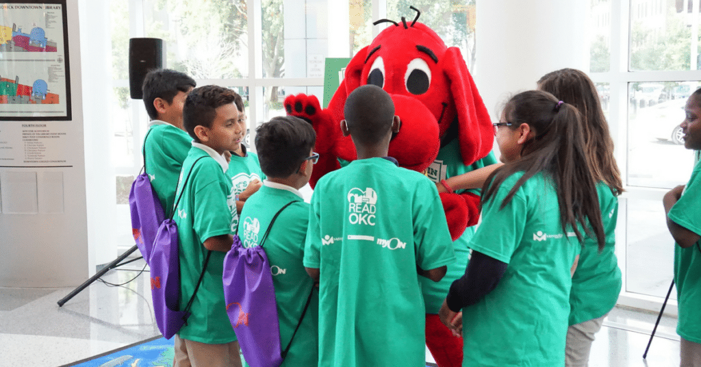 students with red mascot dog