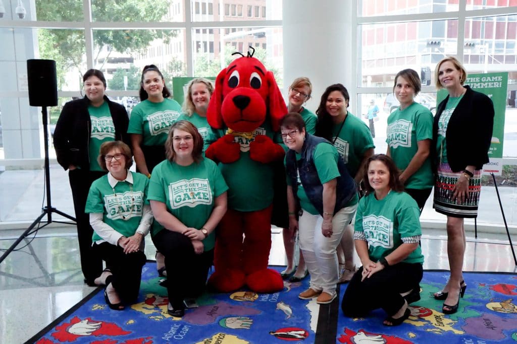 OKCPS Compact Staff posing with Mascot for ReadOKC