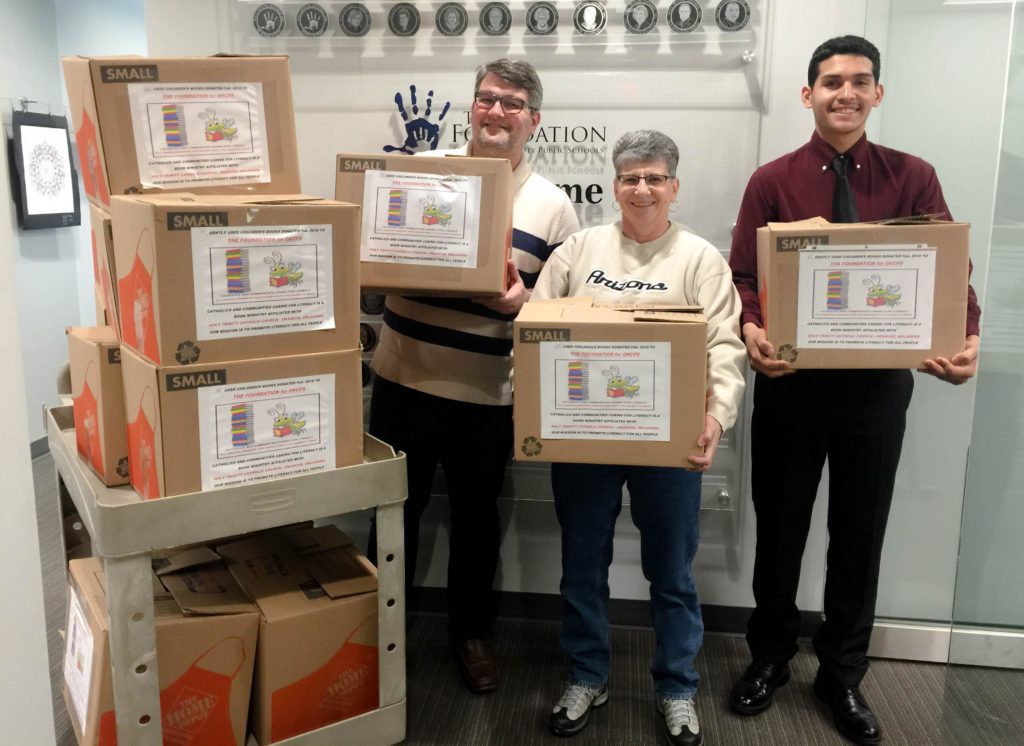 volunteers holding boxes