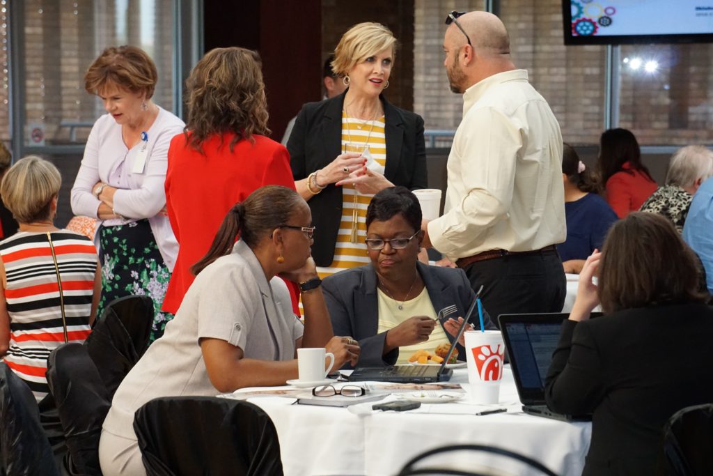 Staff chatting at meeting