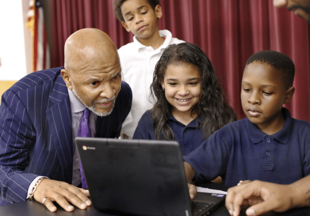 Thurman White with students at computer