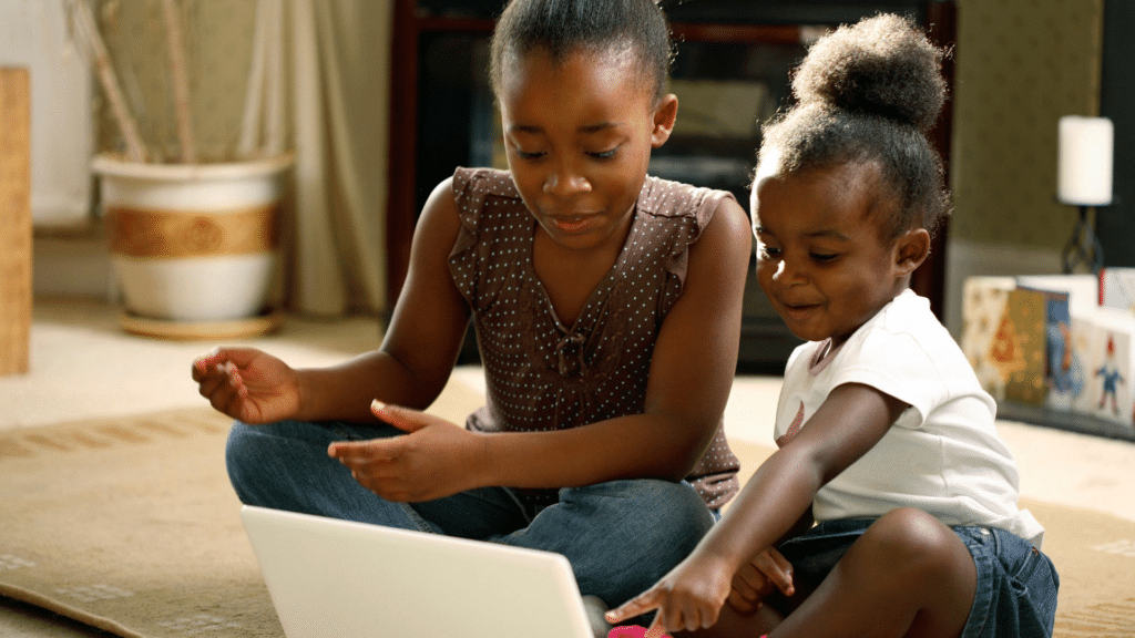 black woman and child reading