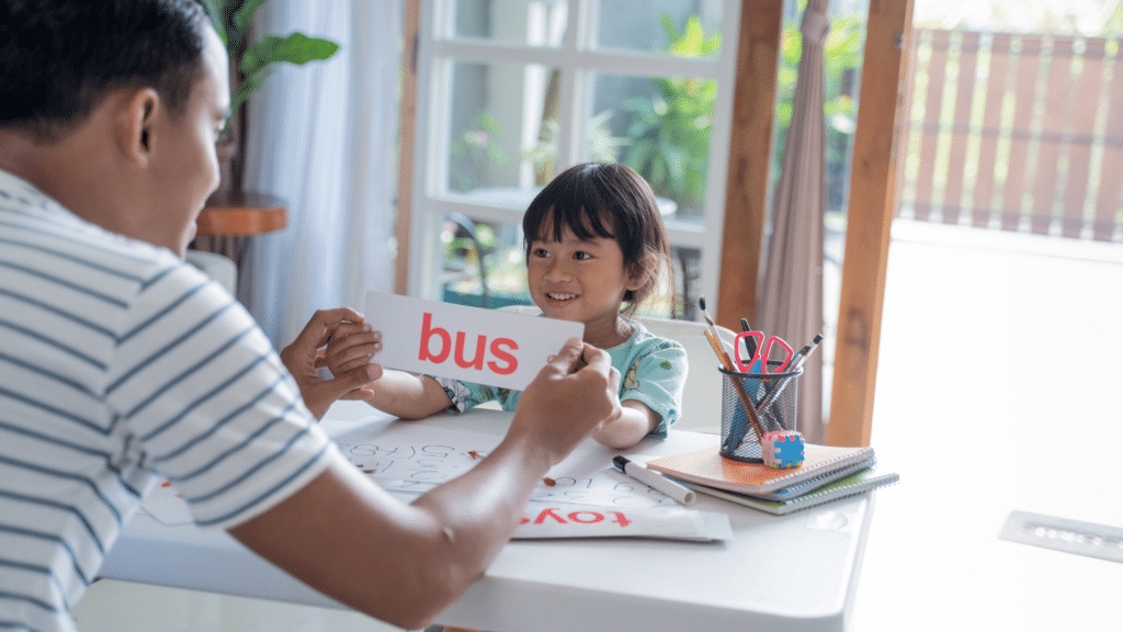 father and daughter learning with flashcards