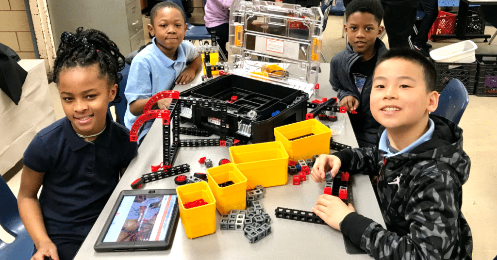 kids at table doing stem activities