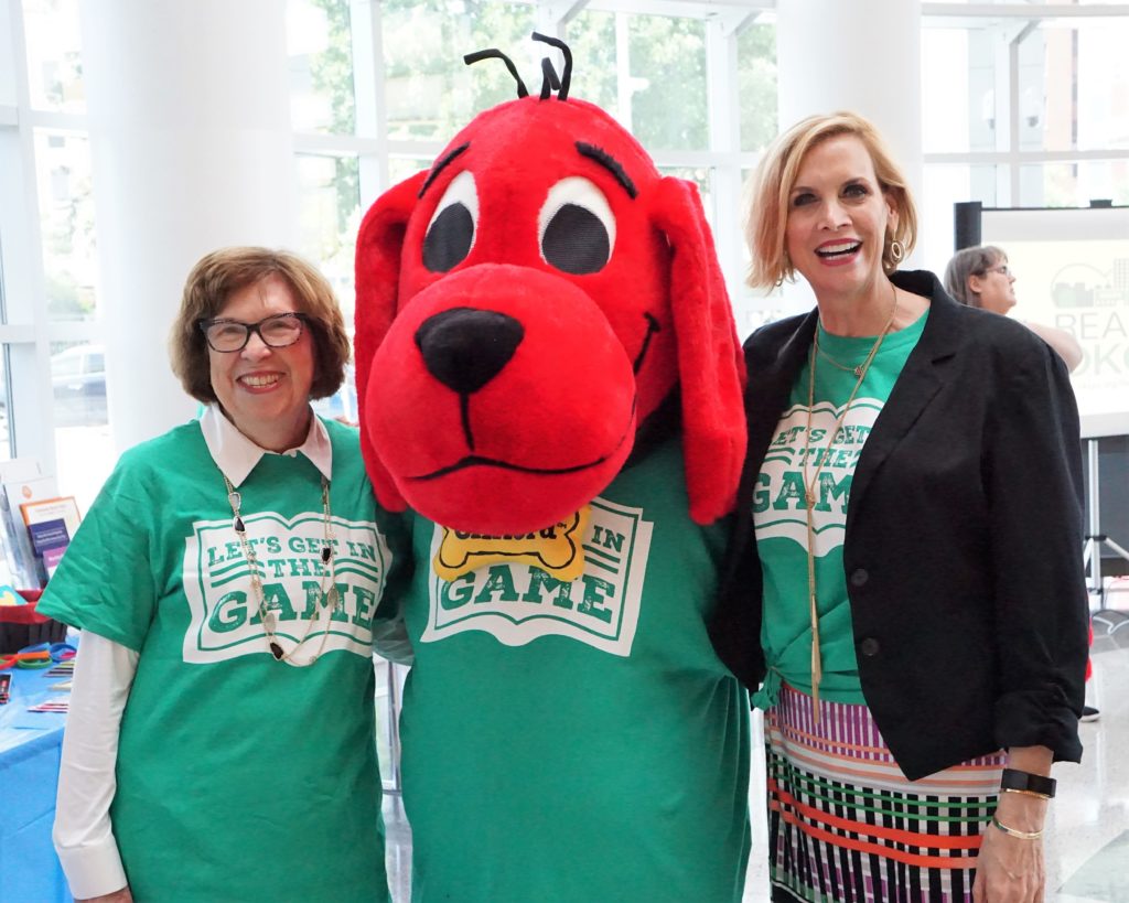 Mascot for ReadOKC posing with Foundation staff