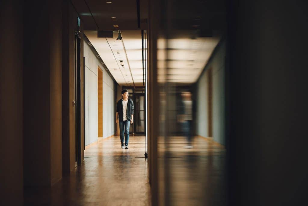 student walking down hallway