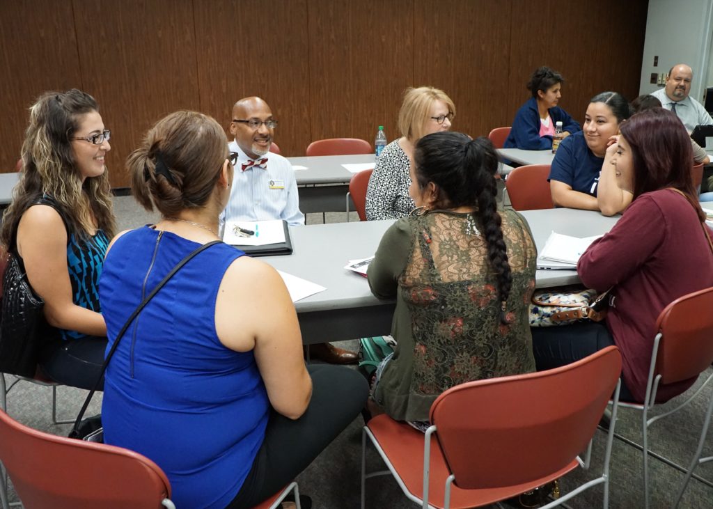 adults sitting at table