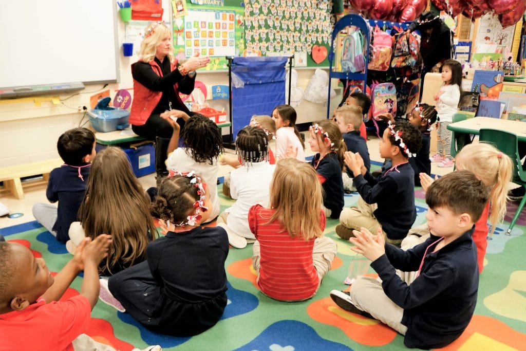 teacher demonstrating activity to students